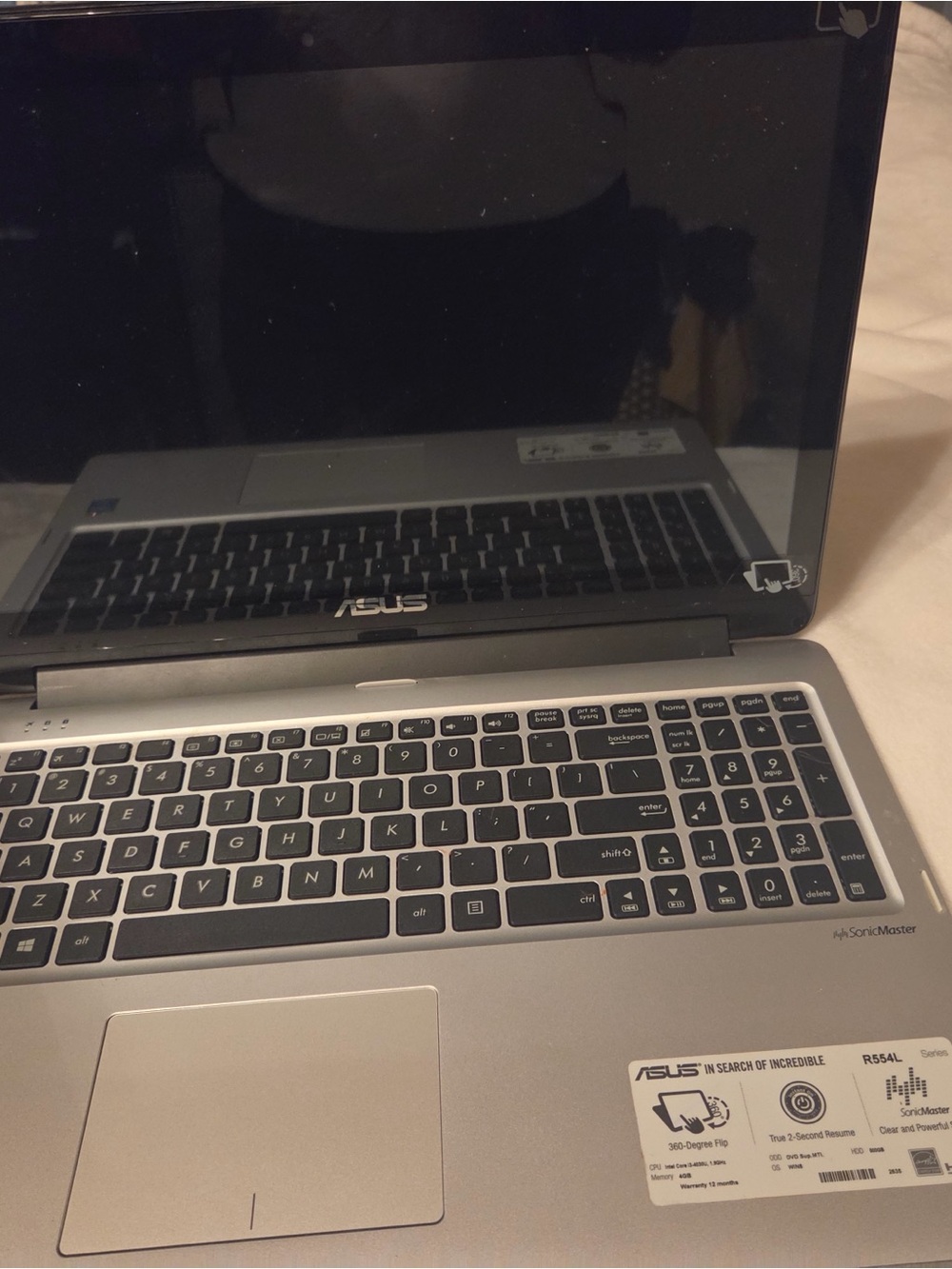 ASUS Silver Laptop with Full Keyboard and Numeric Keypad